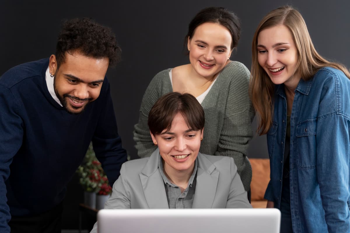 People collaborating at a computer